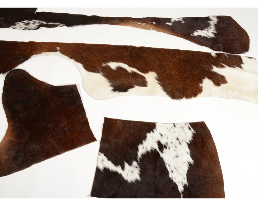 Reddish brown and white cow skin scraps for craft