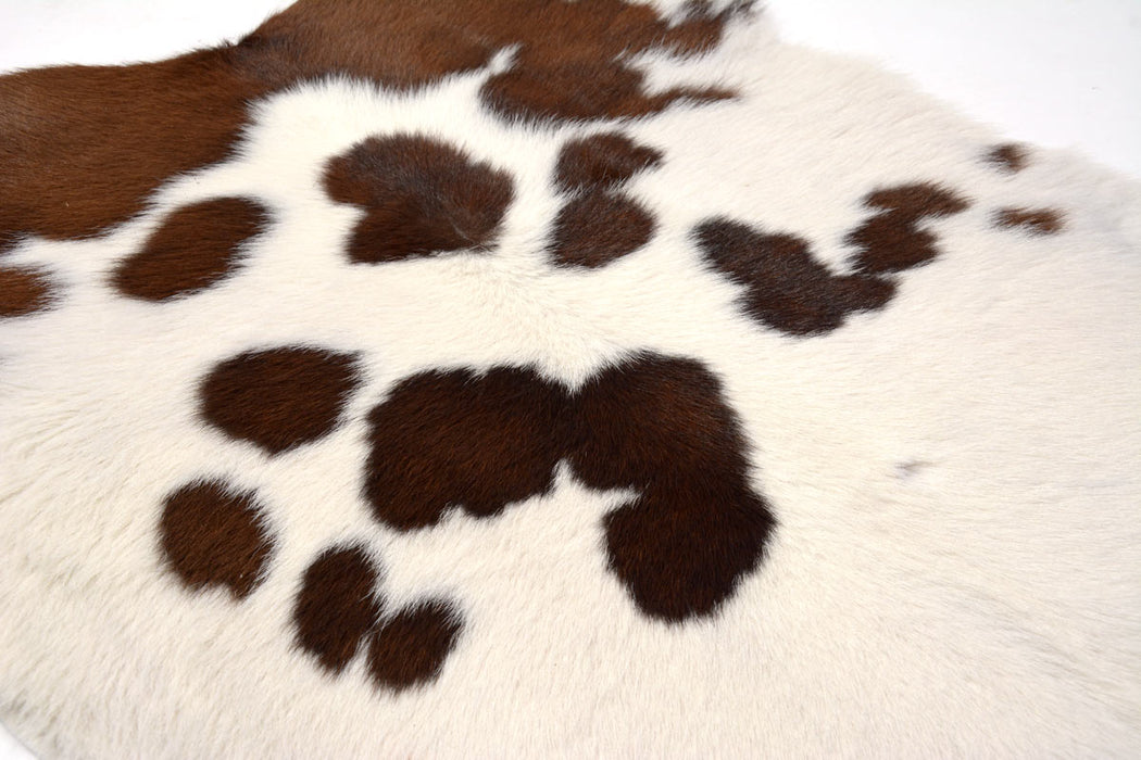 Calfskin rug detail by Gorgeous Creatures #3311 - brown and white