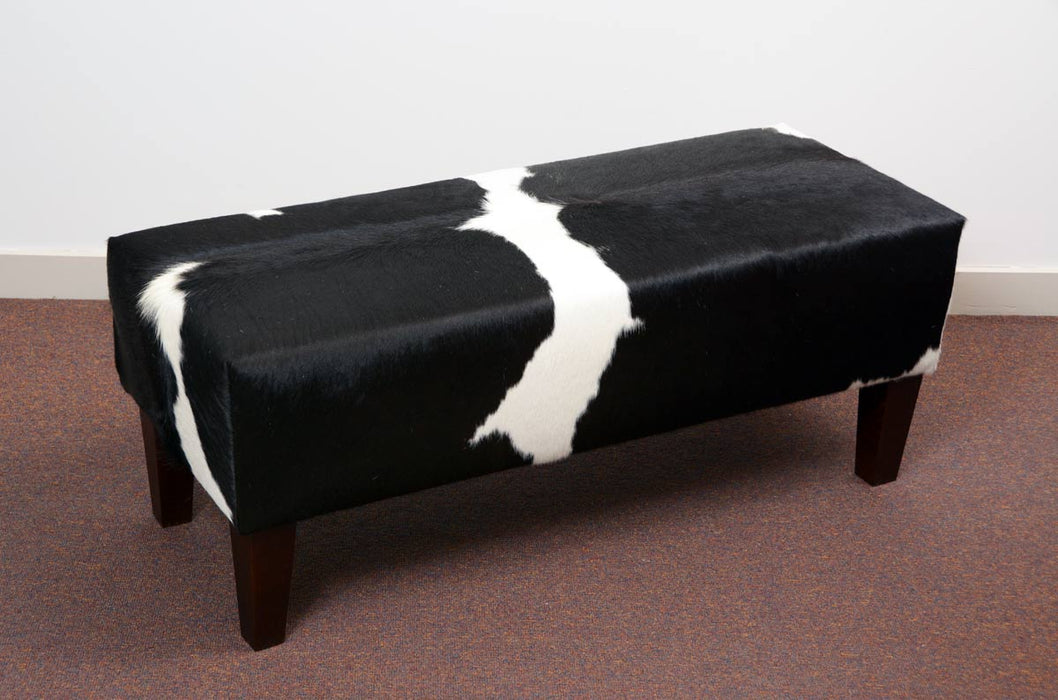 Gorgeous Creatures black & white cowhide bench seat ottoman