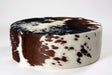 Round cowhide ottoman brown and white