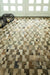Beige cowhide patchwork rug
