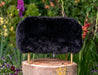 NZ black sheepskin footstool gold legs