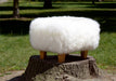 White Sheepskin Footstool with Light Wood Legs