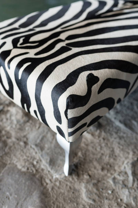 End of bed or bench zebra print cowhide ottoman