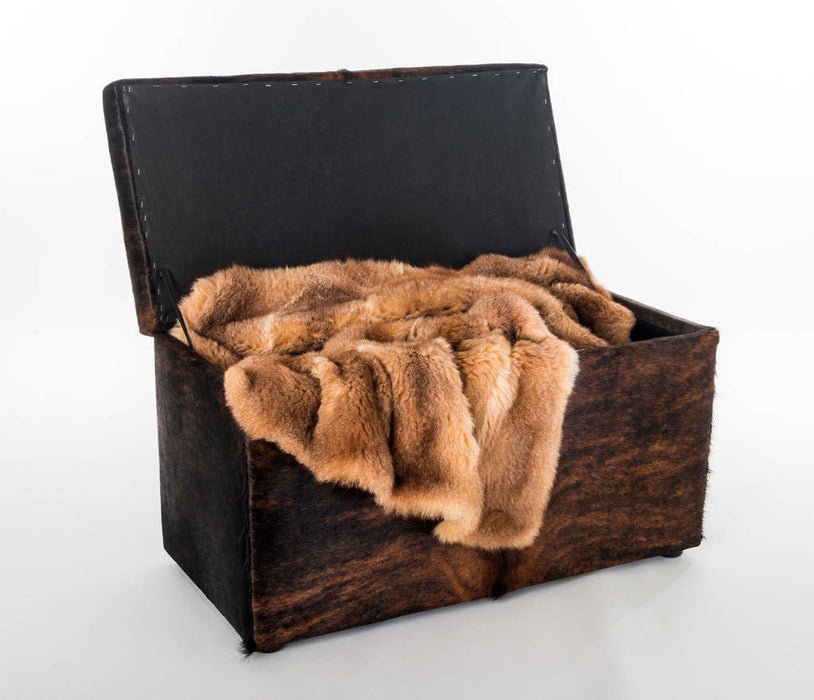 Storage ottoman in cowhide by Gorgeous Creatures