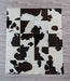 Dark brown and white cowhide patchwork rug